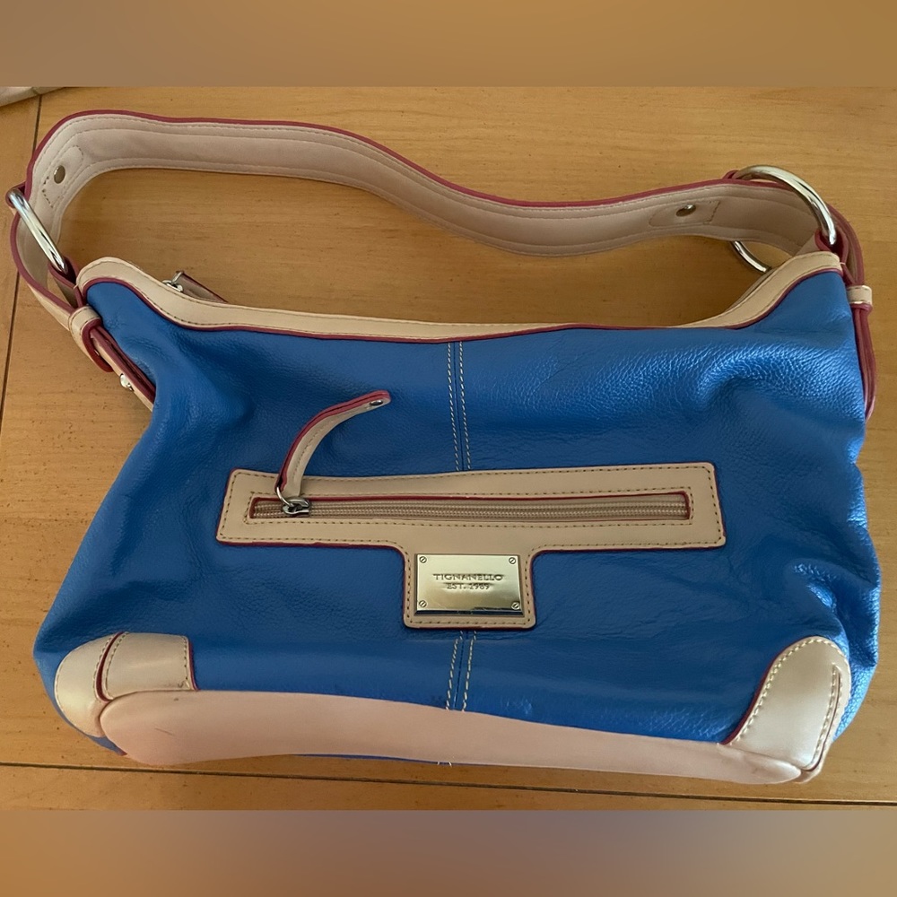 Tignanello blue handbag with tan and red accents. Lightly used. zippered pockets